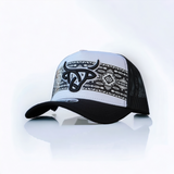White Shima A-Frame hat with black rim, black mesh back and a black Lost Calf logo over a tribal design strip.