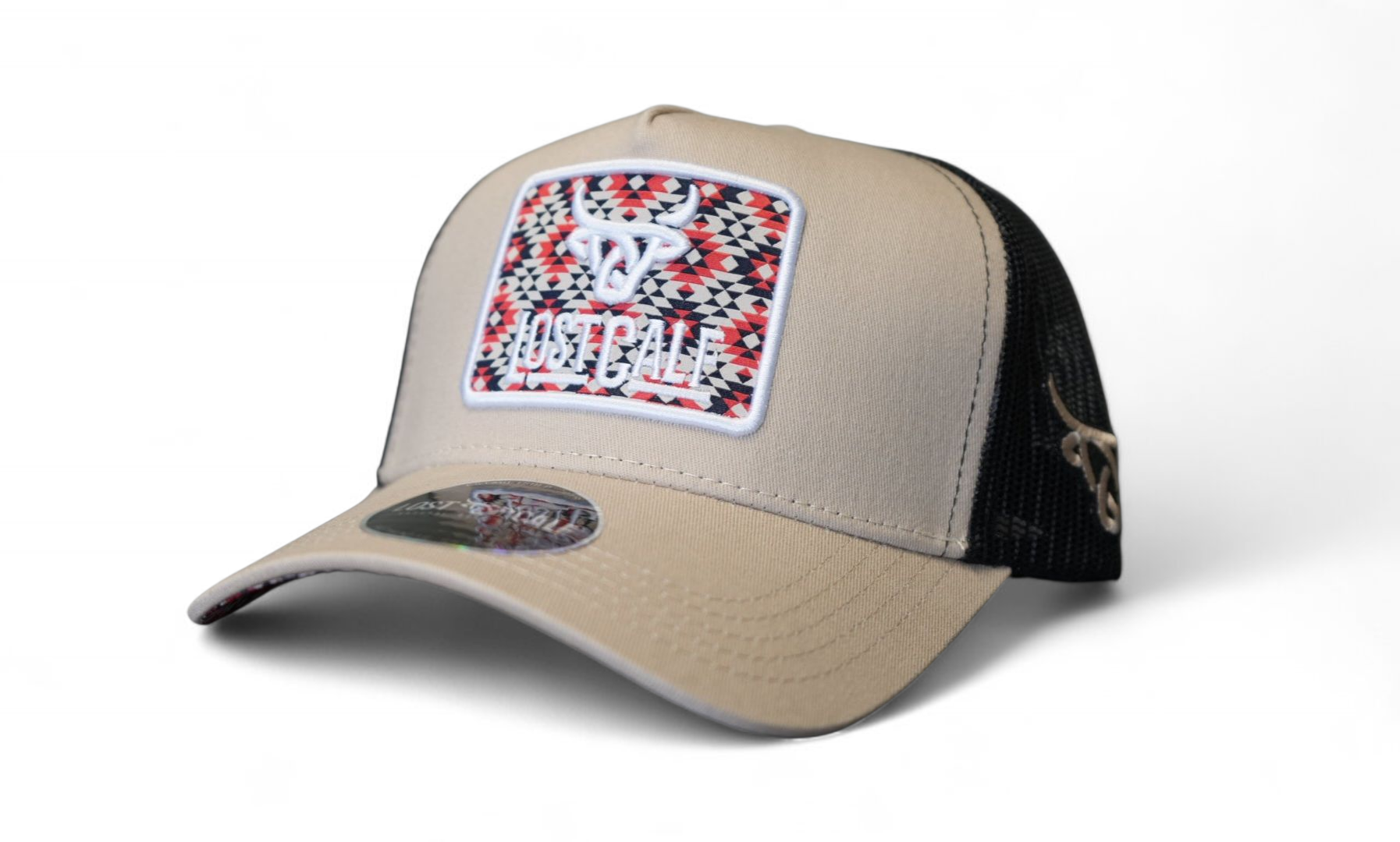 Beige trucker cap with black mesh in back, Lost Calf logo embroidered on a colorful tribal patch up front