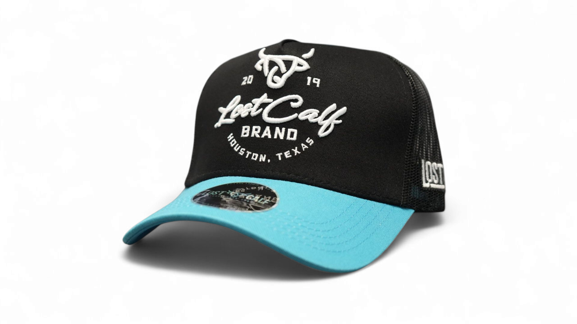 Black snapback with blue rim and black mesh in back, with a white 'Lost Calf' logo