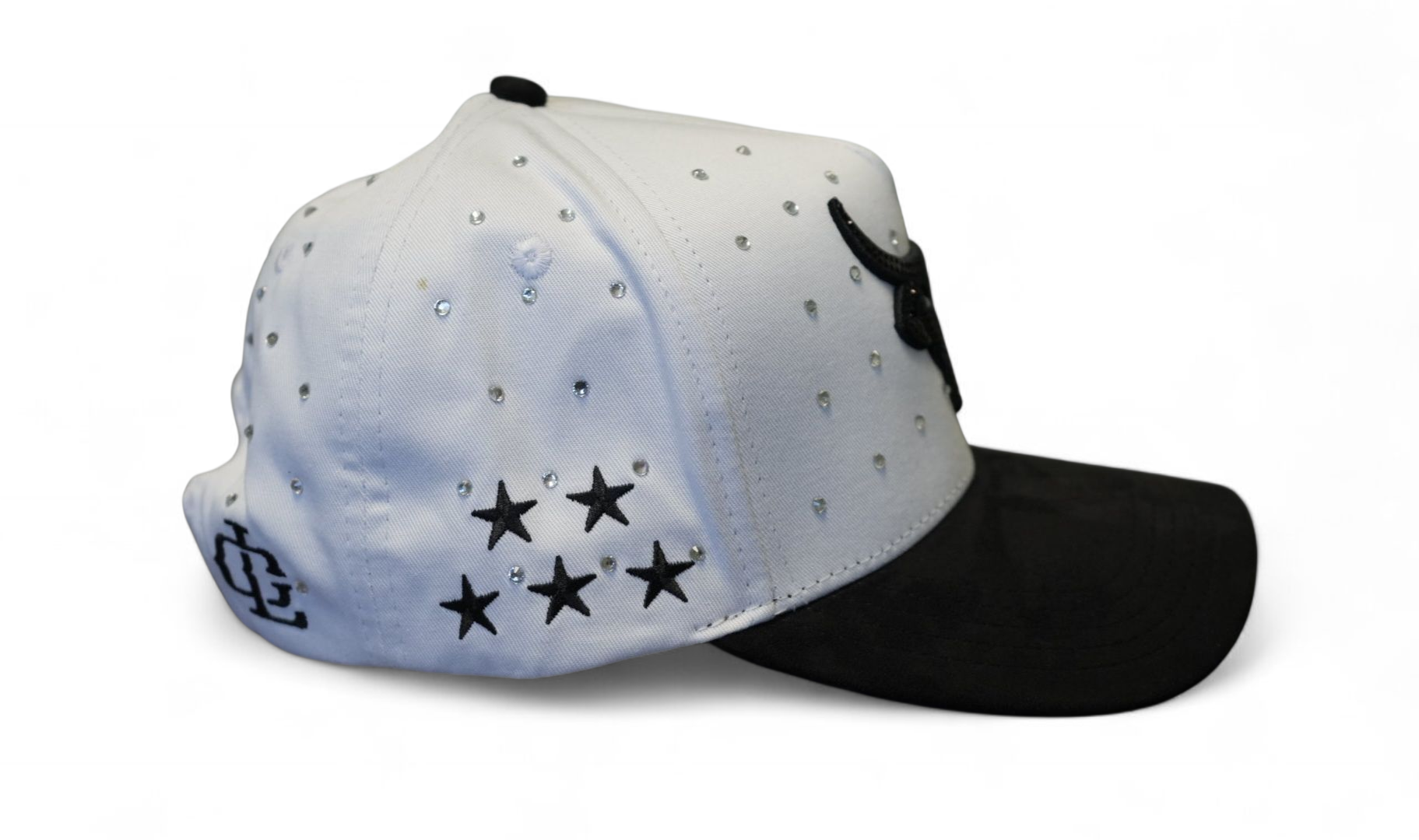 Side View of The Lost Calf White Western Trucker Hat featuring black embroidered branding and a black bill.