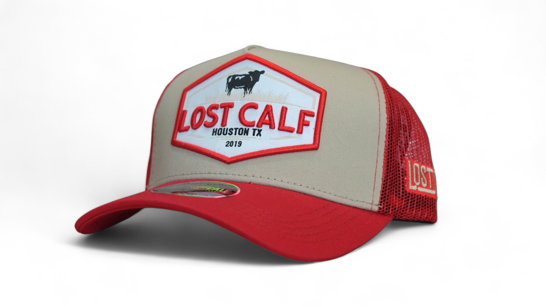 Red and beige cap with a Farm patch stating 'Lost Calf' 